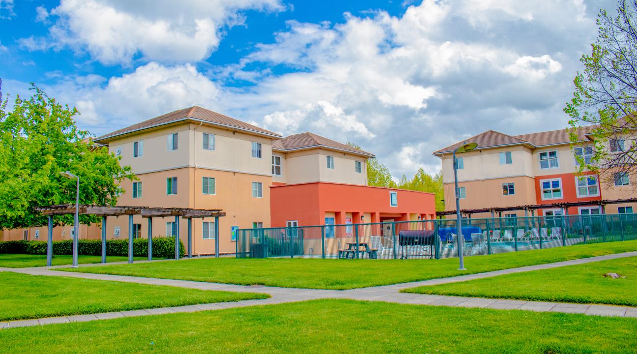 Beaujolais Village buildings in background and lawn area