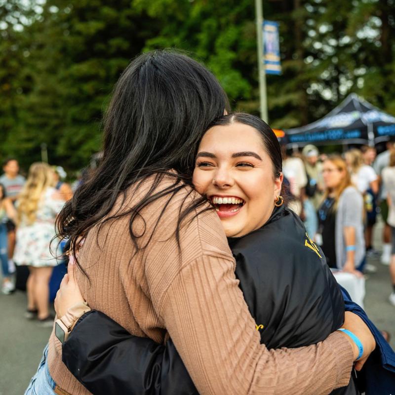 students hugging