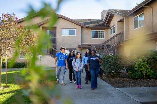 Group of students walking outside in Sauvignon Village
