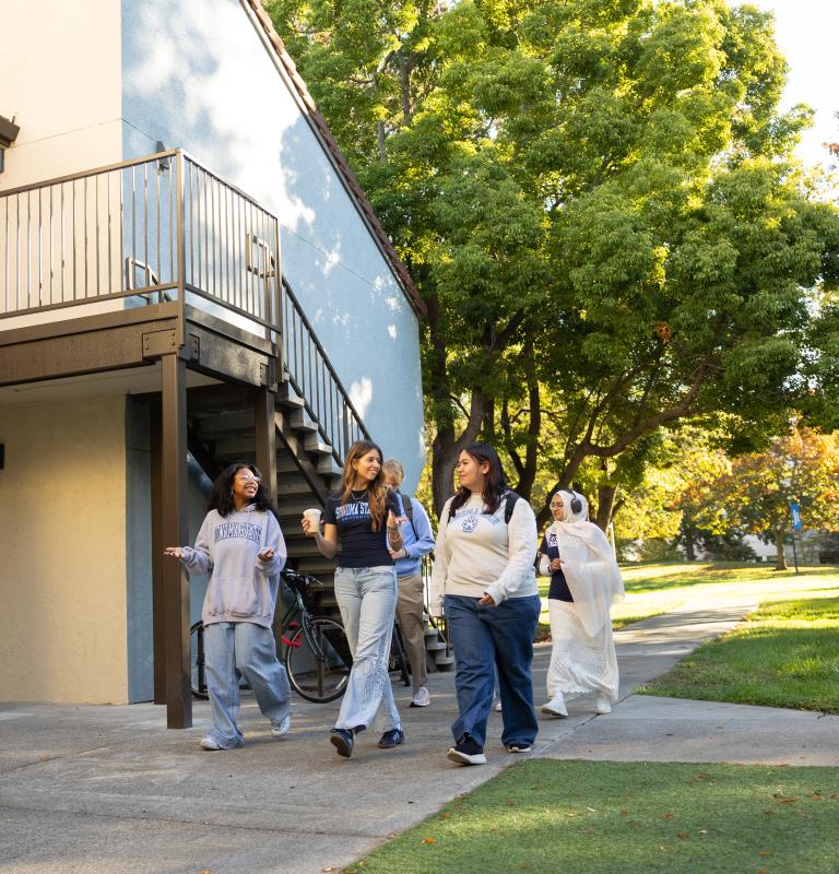 Students walking through housing community