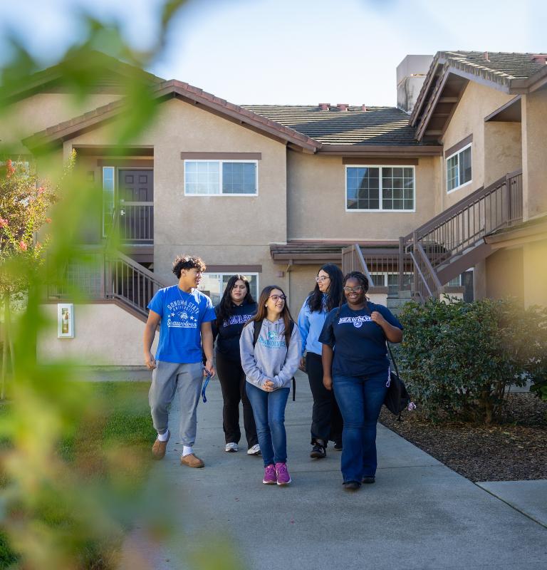 Group of students walking outside in Sauvignon Village