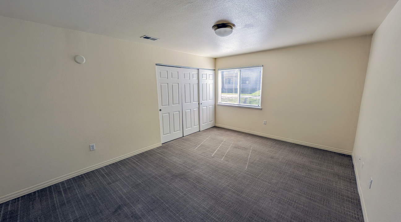 large bedroom with window