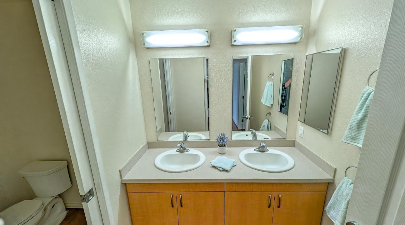 A bathroom with double sinks