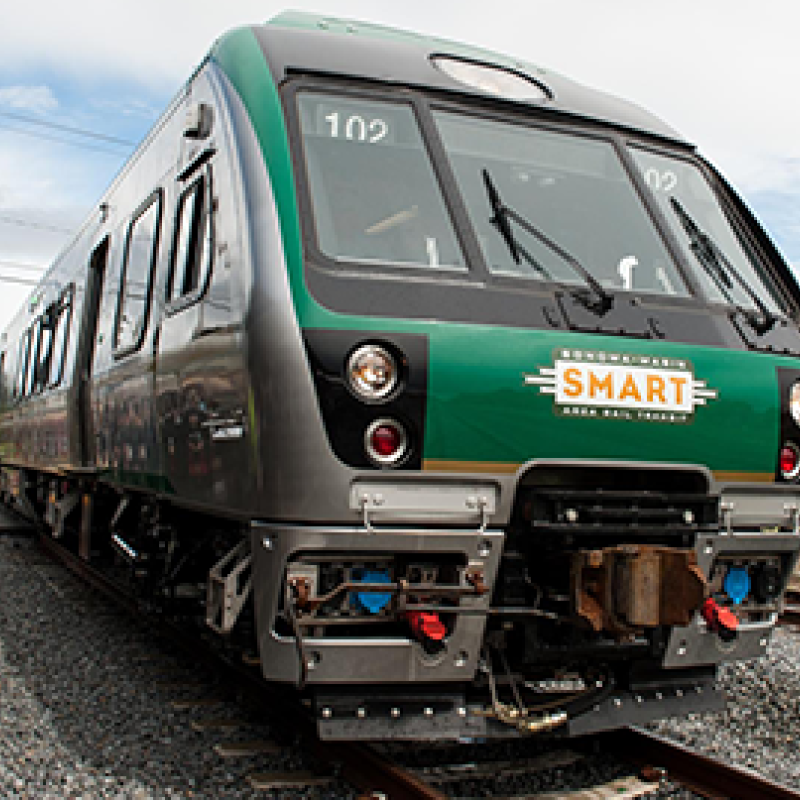 green train with smart train written on the front