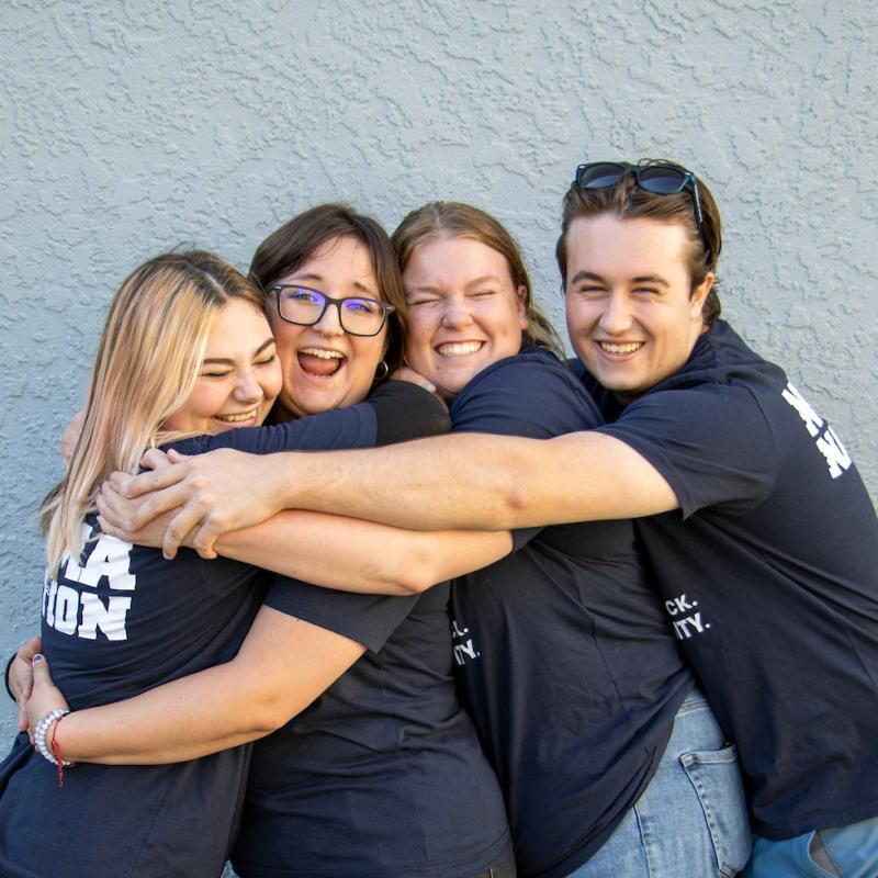 students happy hugging