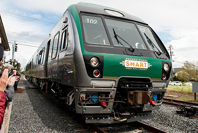 green train with smart train written on the front