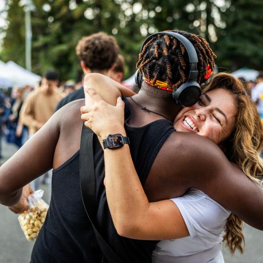 students hugging