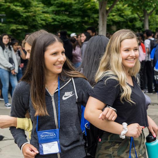 students with linked arms