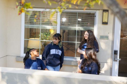 Group of students hanging out on a patio