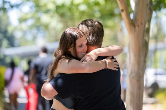 parent and student hugging