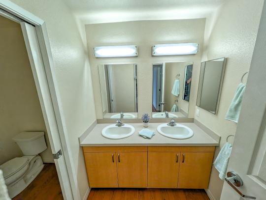 A bathroom with double sinks